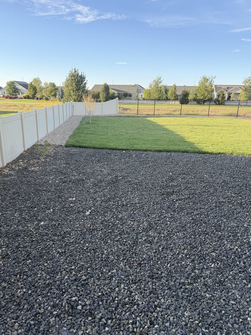 The same Meridian backyard gravel pad left clear and swept after HaulWorks removed the hot tub, cabinet and wiring