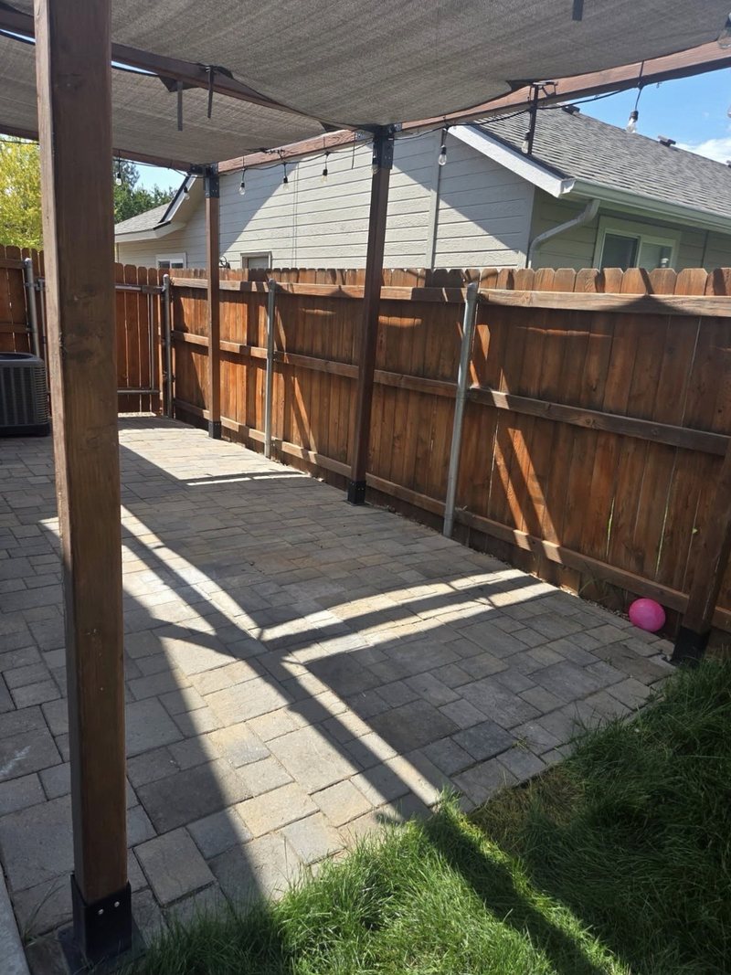 The same Meridian backyard patio swept clean after HaulWorks removed the play structure and debris