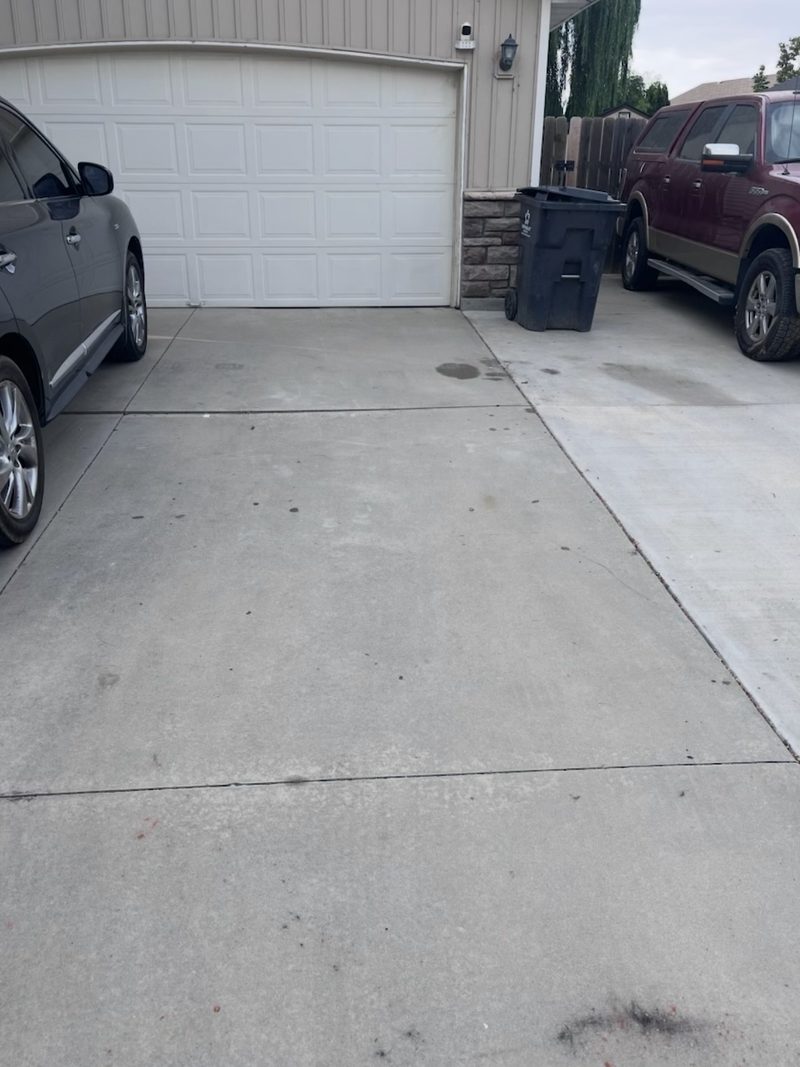 The same Meridian driveway swept empty after HaulWorks hauled the sectional and cat tree away